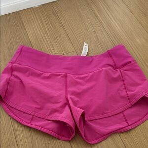 Lululemon sonic pink speed ups length 2.5. Size 4